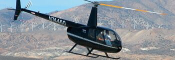 emplacement de jet privé : H130 survole un canyon.